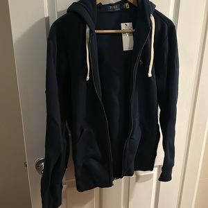 Brand new, tags on navy blue men’s Ralph Lauren sweatshirt
